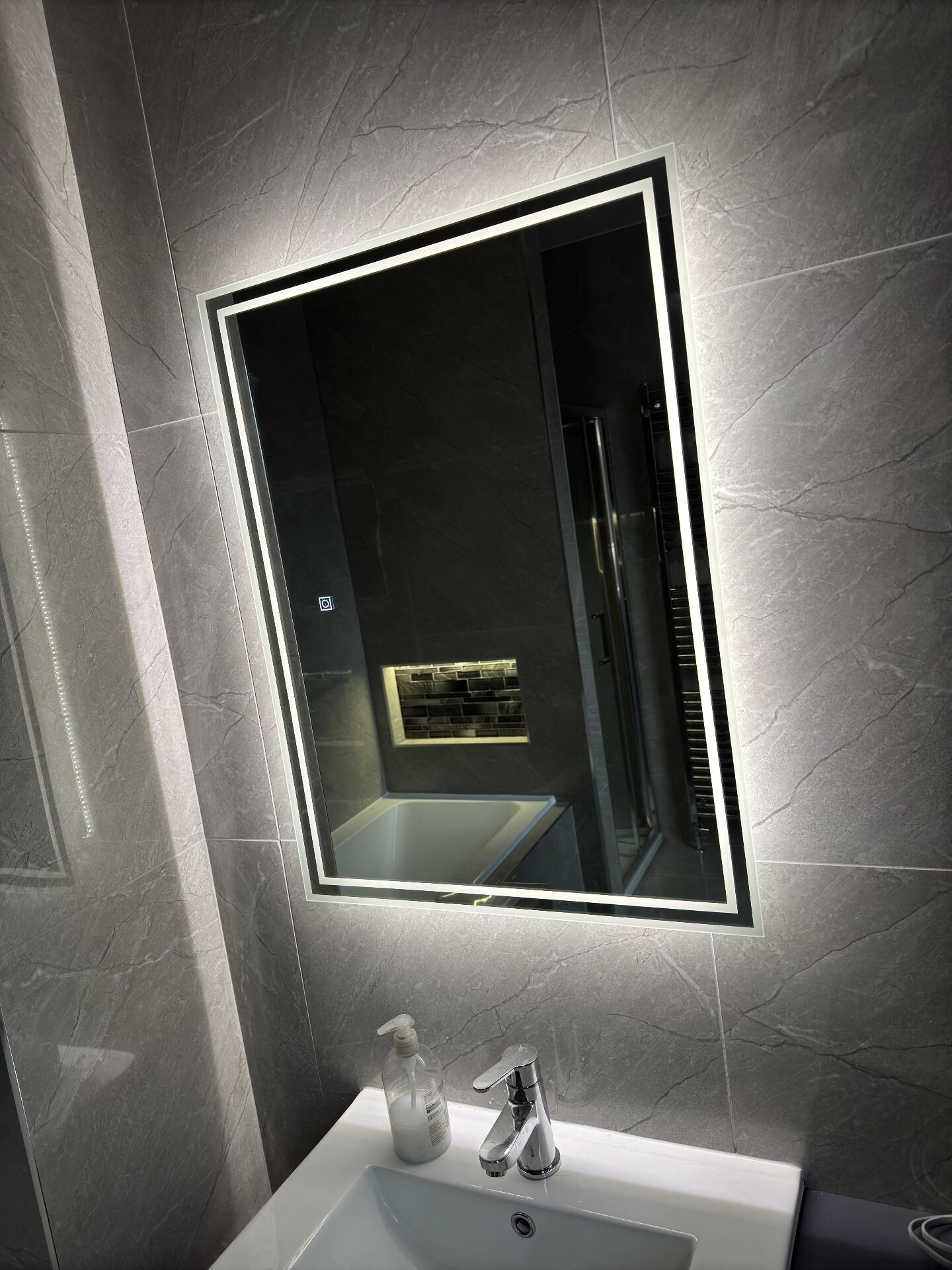 Backlit LED bathroom mirror installation