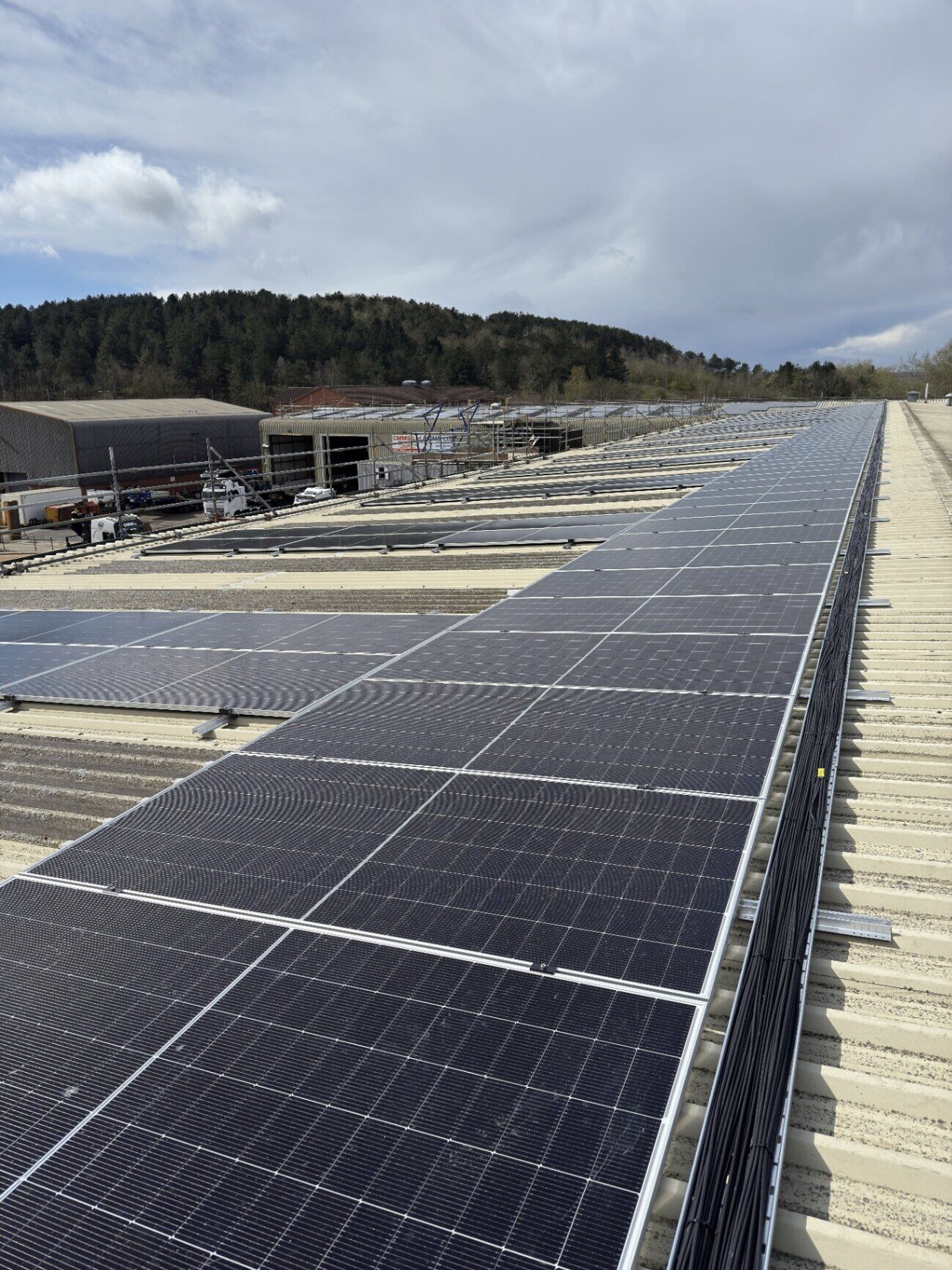Commercial rooftop solar PV installation spanning a large industrial unit roof by Northern Tec